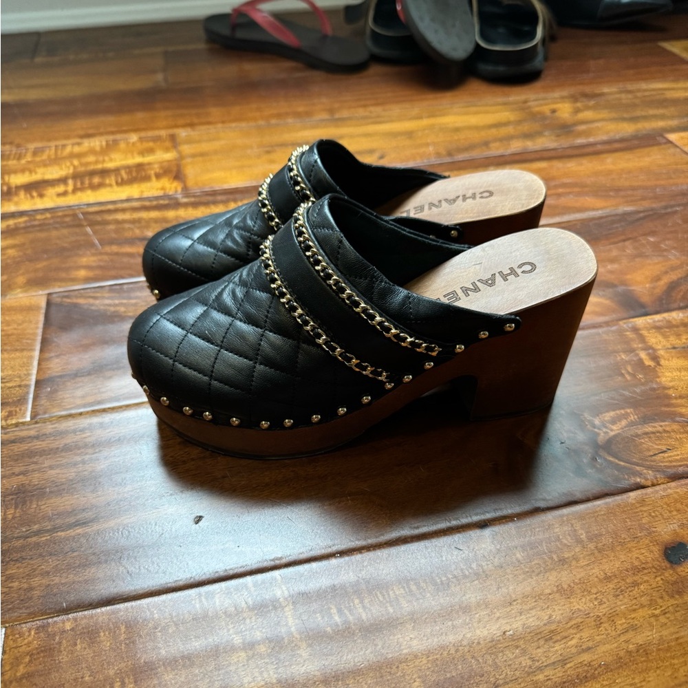 CHANEL Black Quilted Mules with Gold Chain Detail